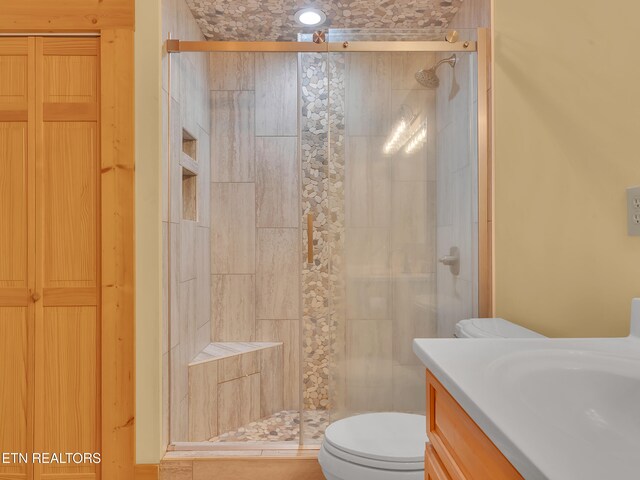 2164 Newt Huff Ln, Sevierville, TN 37862 - bathroom featuring a stall shower, toilet, and vanity