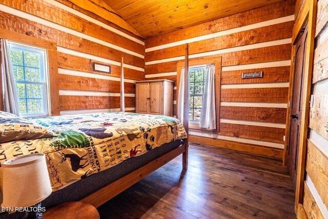 bedroom with wooden ceiling, vaulted ceiling, wooden walls, and hardwood / wood-style flooring