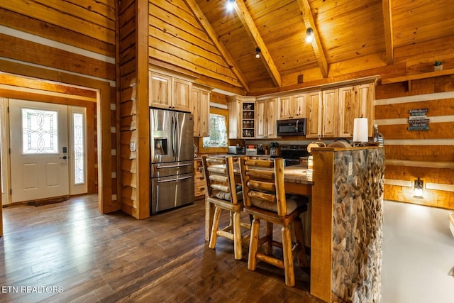 kitchen with black microwave, stainless steel refrigerator with ice dispenser, range with electric stovetop, and plenty of natural light