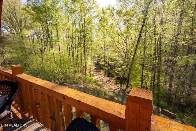 exterior space with a forest view