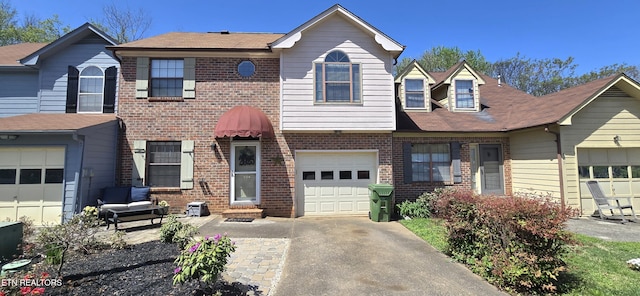 view of front of house with aphalt driveway and brick siding