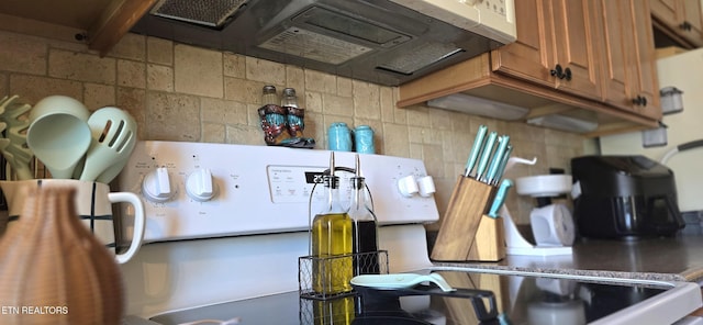 interior space with brown cabinetry and backsplash