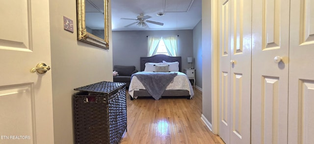 bedroom featuring attic access, baseboards, visible vents, and light wood-type flooring