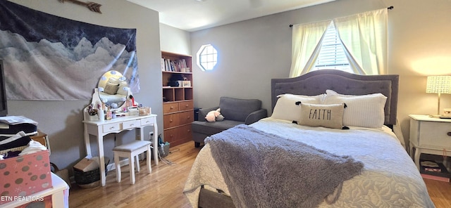 bedroom with wood finished floors