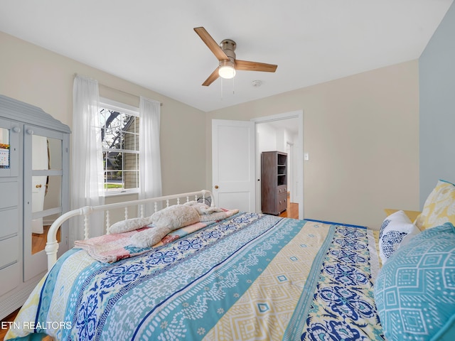 bedroom featuring wood finished floors and ceiling fan