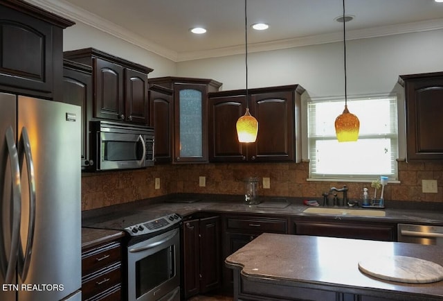 891 Forgety Rd, Jefferson City, TN 37760 - kitchen with stainless steel appliances, dark countertops, dark brown cabinets, backsplash, and ornamental molding