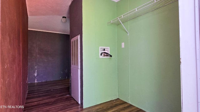 laundry area with wood finished floors and washer hookup