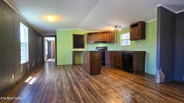 kitchen with a sink, under cabinet range hood, black appliances, dark wood-type flooring, and a kitchen island