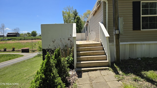 exterior space featuring a deck and a lawn