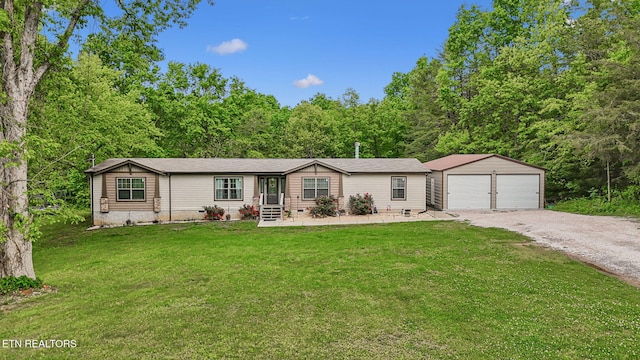 160 Walnut Ln, Rutledge, TN 37861 - manufactured / mobile home featuring a garage, crawl space, a front lawn, an outbuilding, and gravel driveway