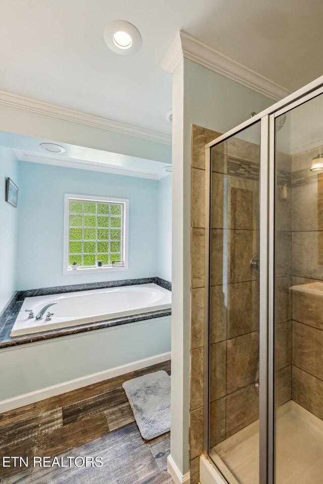 160 Walnut Ln, Rutledge, TN 37861 - bathroom with a stall shower, ornamental molding, a garden tub, and wood finished floors