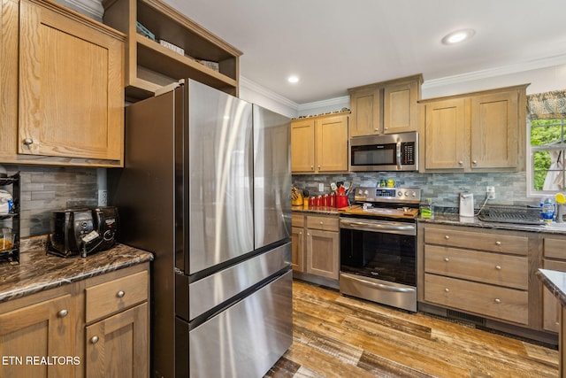 160 Walnut Ln, Rutledge, TN 37861 - kitchen with crown molding, stainless steel appliances, tasteful backsplash, and light wood-style flooring
