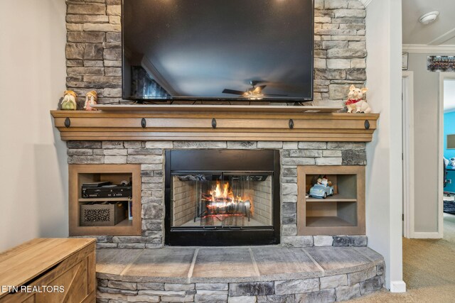 160 Walnut Ln, Rutledge, TN 37861 - details with baseboards, a stone fireplace, ceiling fan, crown molding, and carpet floors
