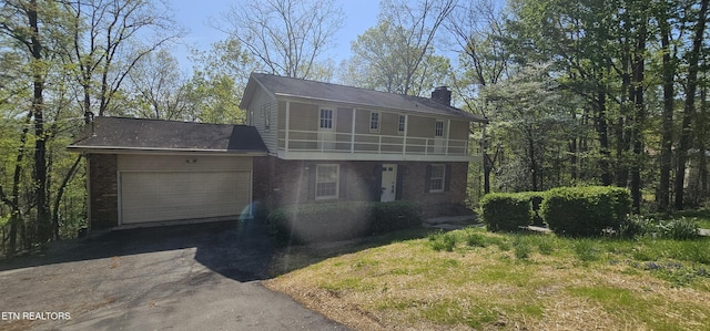 115 Morgan Rd, Oak Ridge, TN 37830 - view of front of house featuring brick siding, a chimney, an attached garage, and aphalt driveway