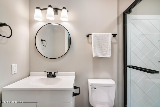 bathroom featuring toilet and vanity