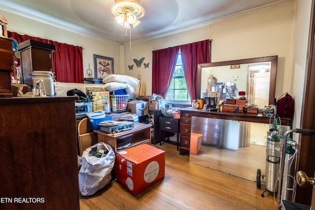 interior space featuring ornamental molding, ceiling fan, and hardwood / wood-style floors