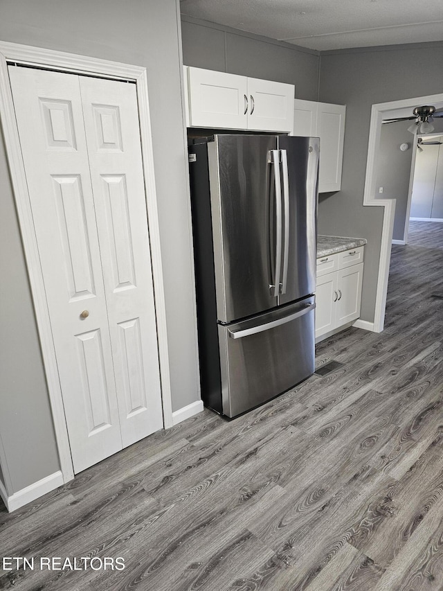 367 Mcjunkin Rd, Tellico Plains, TN 37385 - kitchen with freestanding refrigerator, white cabinetry, baseboards, and wood finished floors