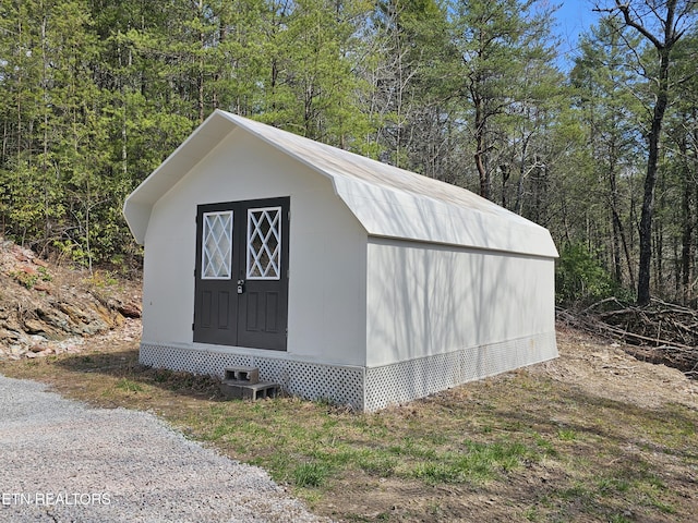 367 Mcjunkin Rd, Tellico Plains, TN 37385 - view of outbuilding with an outdoor structure and a view of trees