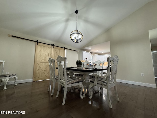 dining area with dark wood finished floors, baseboards, a barn door, and an inviting chandelier