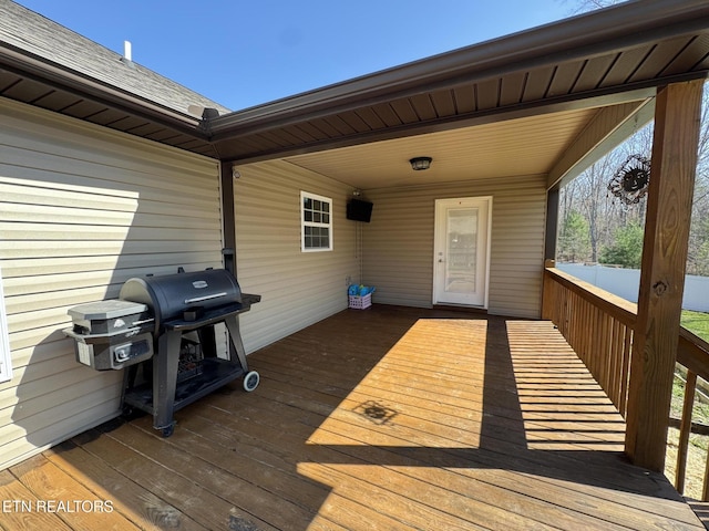 wooden deck featuring area for grilling