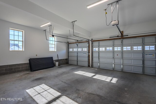 garage featuring a garage door opener