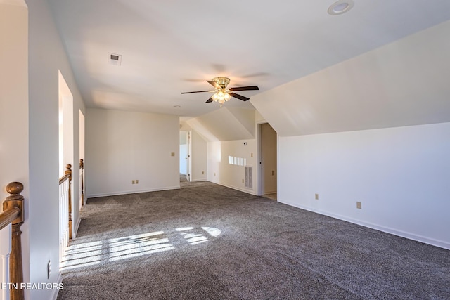 additional living space with a ceiling fan, lofted ceiling, baseboards, visible vents, and carpet