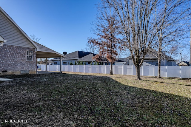 view of yard with a fenced backyard