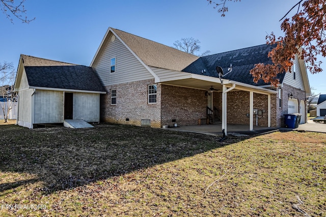rear view of property with brick siding, crawl space, roof with shingles, and a patio