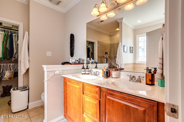 bathroom with tile patterned flooring, a sink, and crown molding