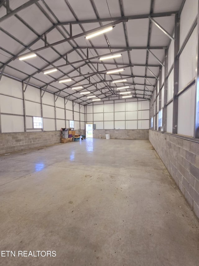 garage with concrete block wall