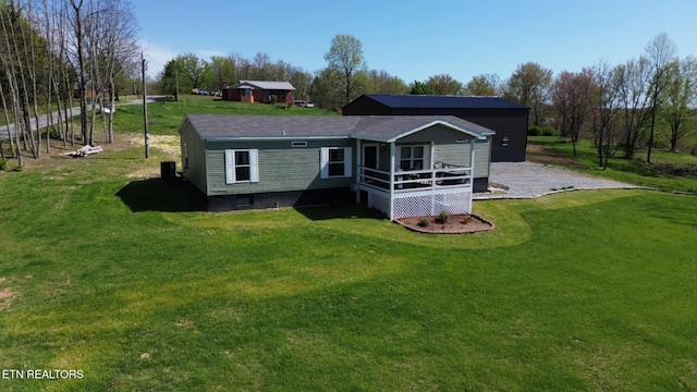 back of house with a yard and a deck