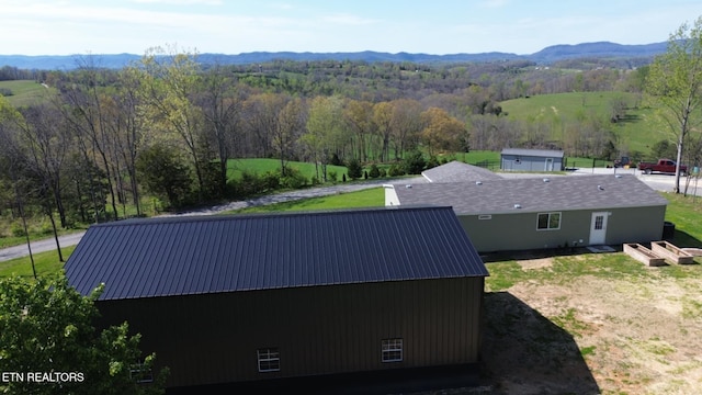 birds eye view of property featuring a mountain view