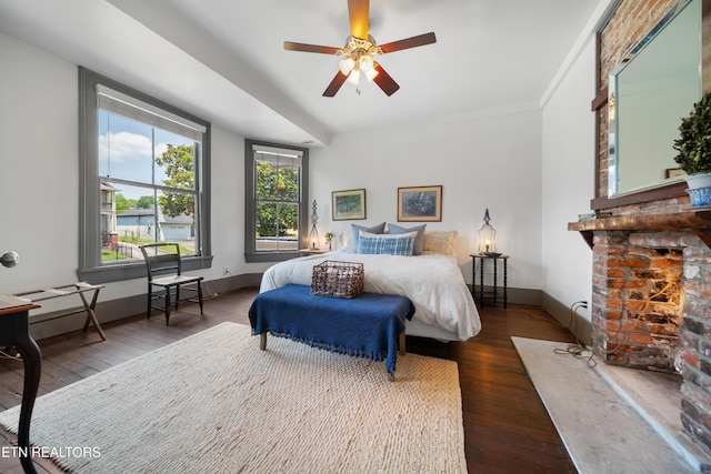 bedroom with hardwood / wood-style floors and baseboards