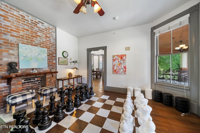 interior space with baseboards and wood finished floors