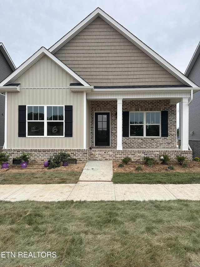 110 Roseberry St Lot 6B, Oak Ridge, TN 37830 - view of front of home with board and batten siding, covered porch, and a front lawn