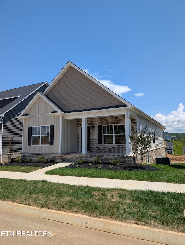 110 Roseberry St Lot 6B, Oak Ridge, TN 37830 - view of front of home featuring covered porch, a front lawn, brick siding, and board and batten siding