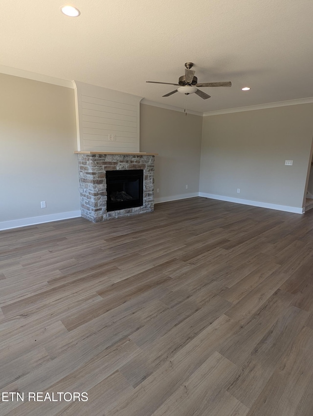 112 Roseberry St Lot 7B, Oak Ridge, TN 37830 - unfurnished living room featuring ornamental molding, ceiling fan, a stone fireplace, wood finished floors, and recessed lighting
