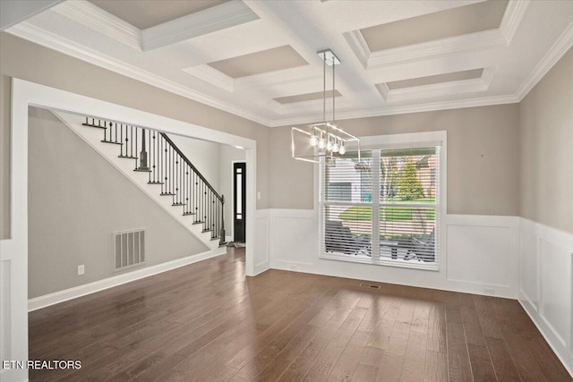 unfurnished dining area featuring crown molding, stairway, a chandelier, dark wood finished floors, and visible vents