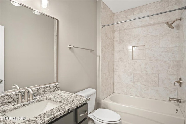 full bathroom featuring toilet, vanity, and bathing tub / shower combination