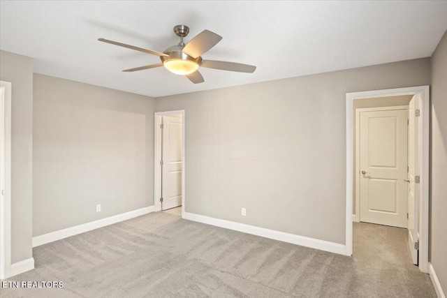 unfurnished bedroom featuring baseboards, ceiling fan, and carpet