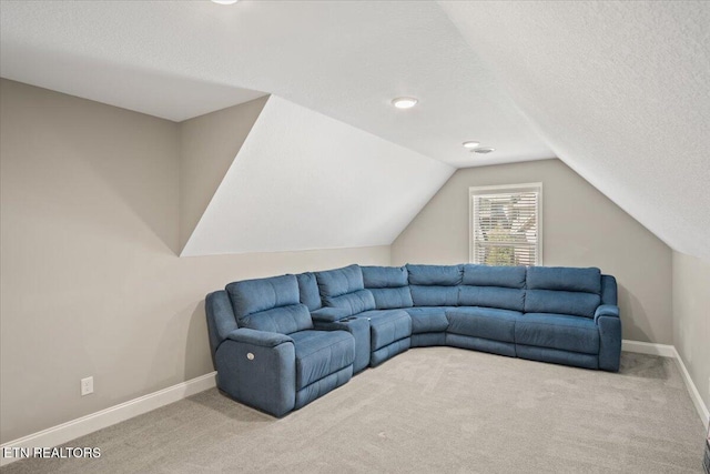 living room featuring baseboards, carpet flooring, a textured ceiling, and vaulted ceiling