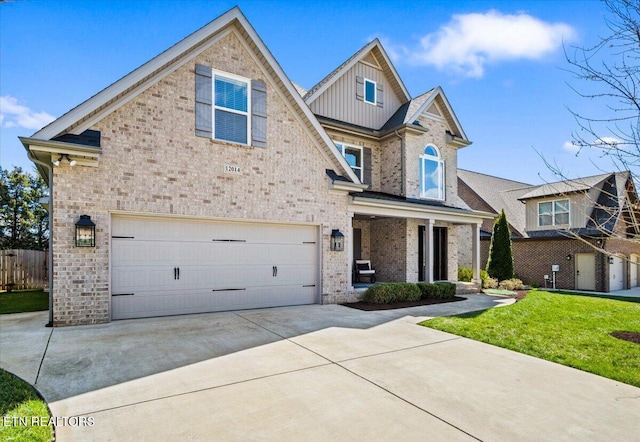 view of front of house with concrete driveway, fence, board and batten siding, a front yard, and a garage