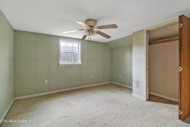 unfurnished bedroom with baseboards, a ceiling fan, carpet flooring, and a closet