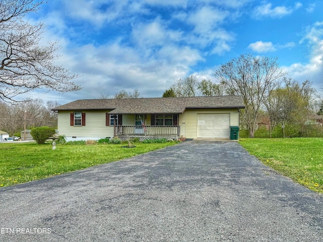 ranch-style home with covered porch, a front yard, aphalt driveway, and an attached garage