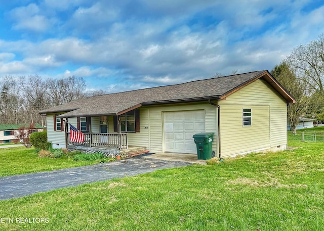 view of front of house with driveway, a front yard, crawl space, and an attached garage
