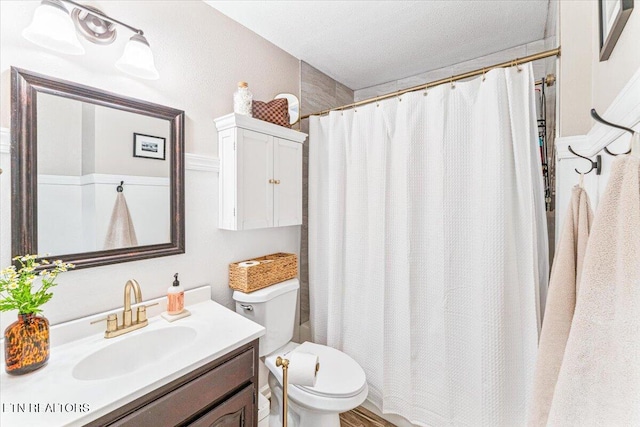 full bath with a shower with shower curtain, toilet, and vanity