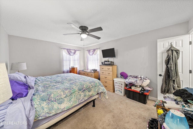 carpeted bedroom featuring a ceiling fan