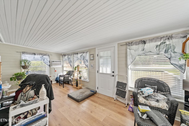 sunroom / solarium with an AC wall unit