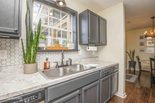 5836 Windtree Ln, Knoxville, TN 37921 - kitchen with an inviting chandelier, dishwasher, a sink, dark wood-style flooring, and gray cabinets