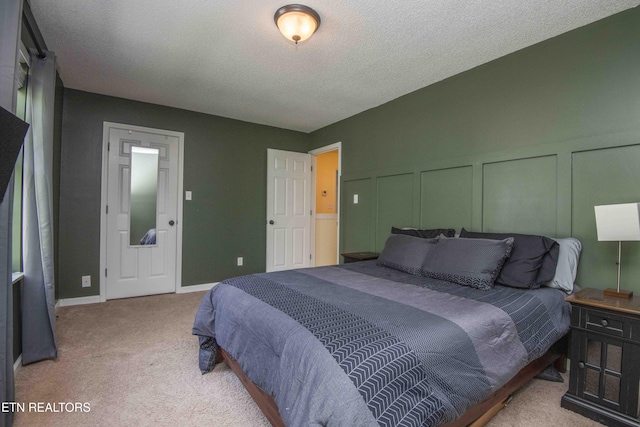 5836 Windtree Ln, Knoxville, TN 37921 - bedroom with a decorative wall, a textured ceiling, and carpet floors